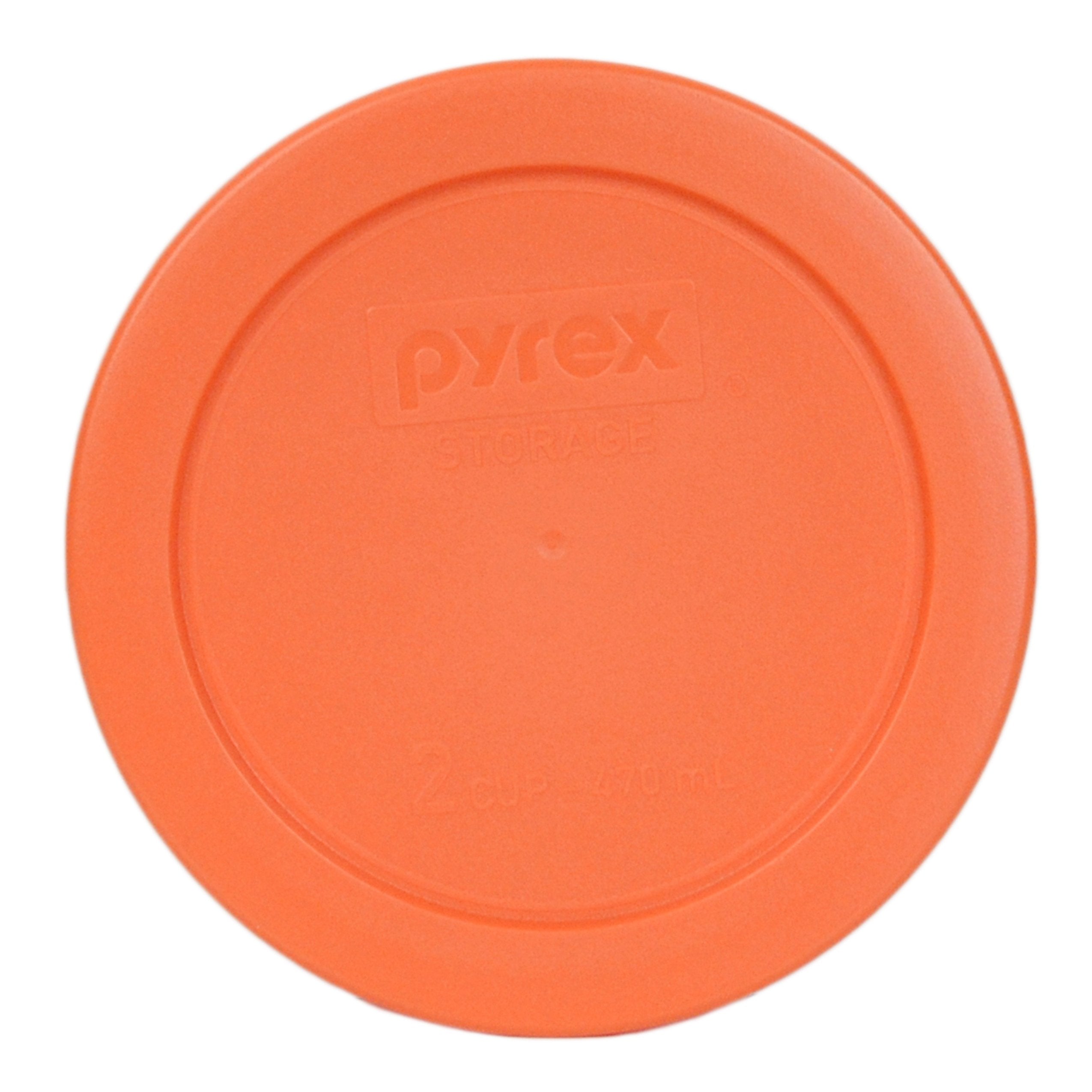 Orange Pyrex lid shown on glass bowl ready for dishwasher top rack