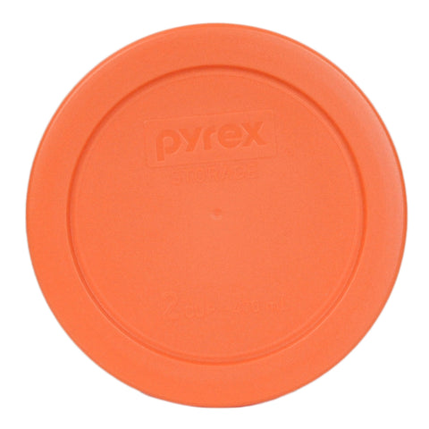 Orange Pyrex lid shown on glass bowl ready for dishwasher top rack