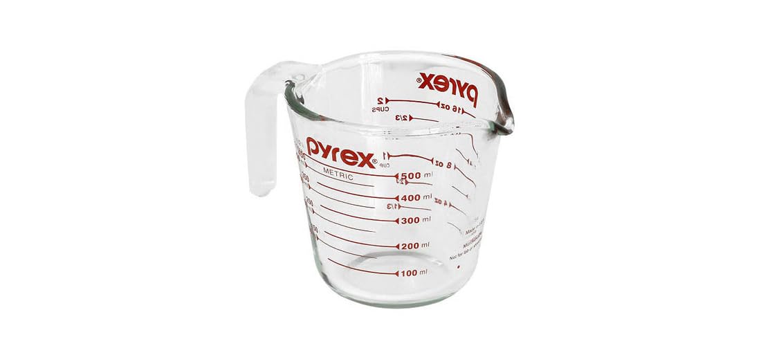 Pyrex Prepware measuring cup with red graphics and visible measurement marks for accurate prep.