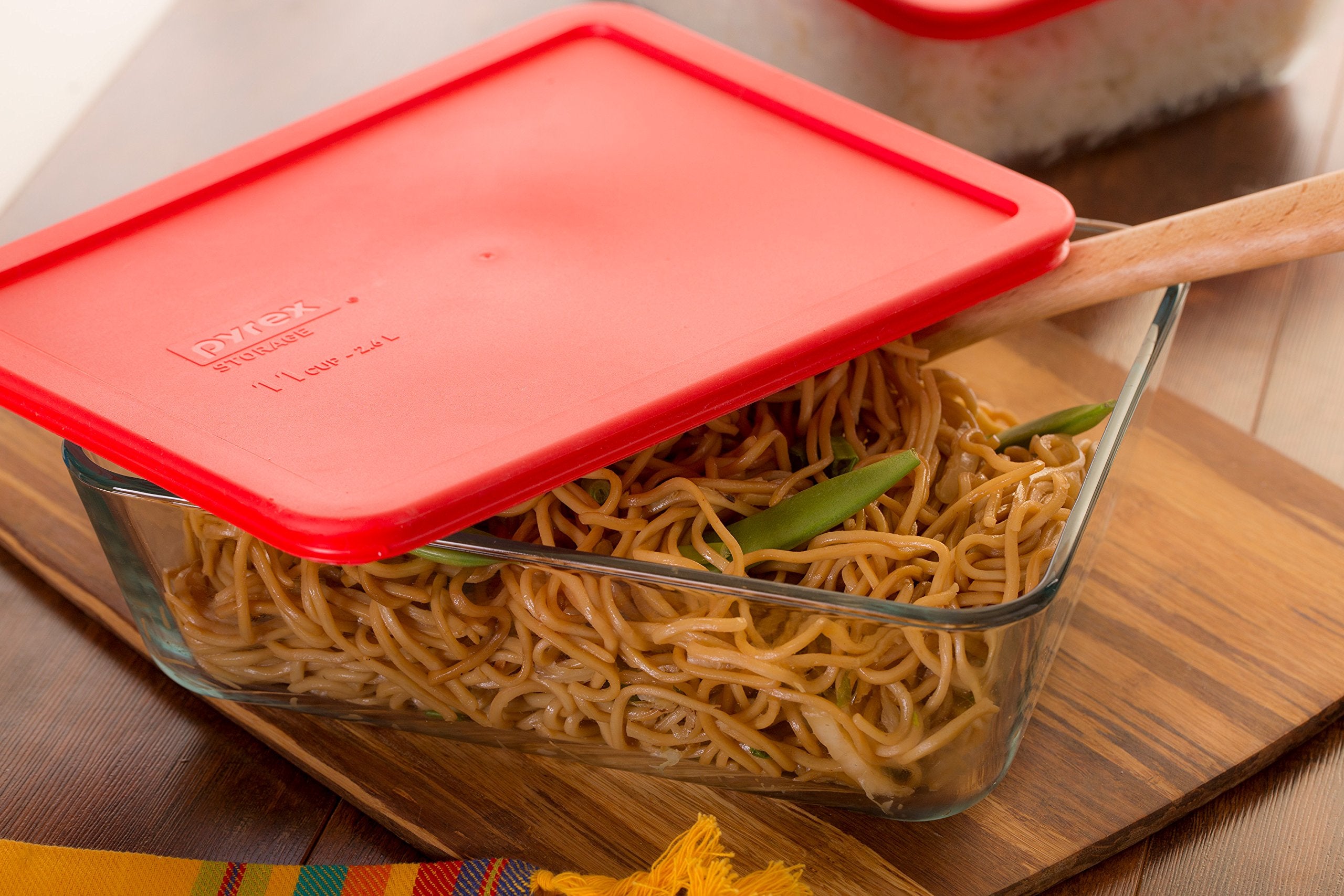Pyrex Simply Store 11-Cup rectangular dish with leftovers, showcased for easy portioning.