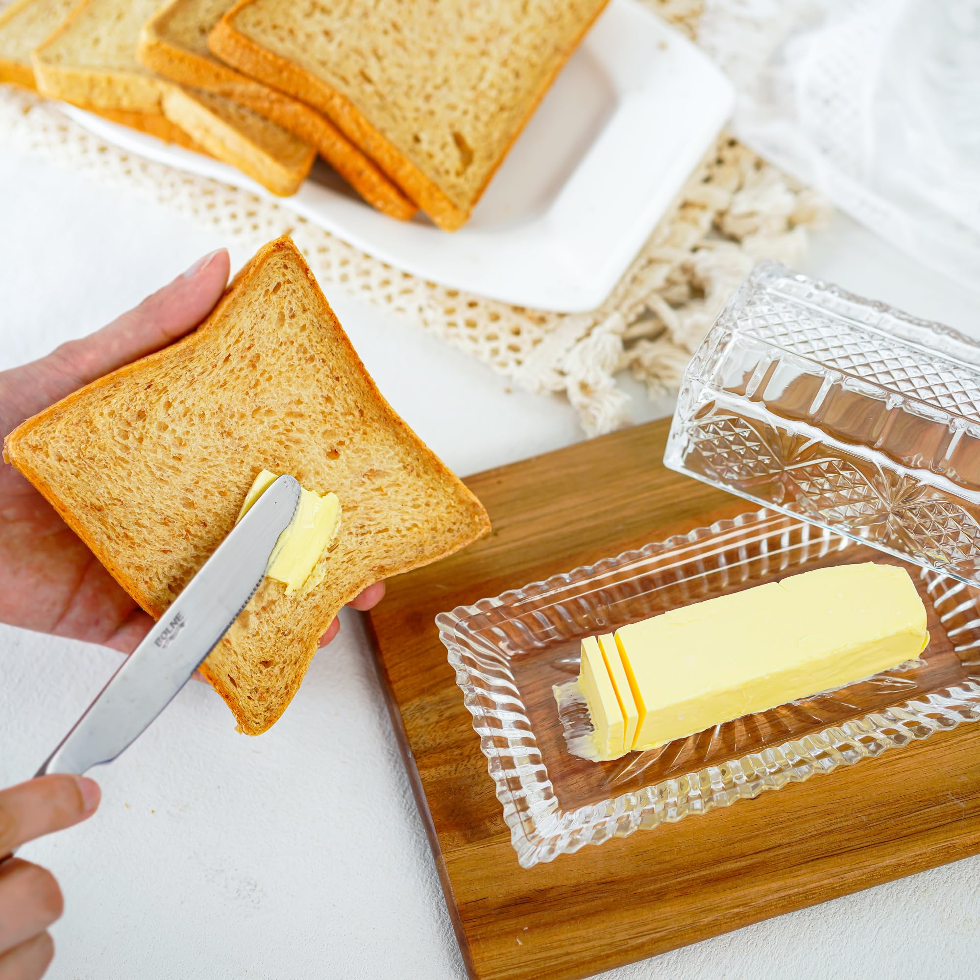 QFkris butter dish with lid open, ready for serving