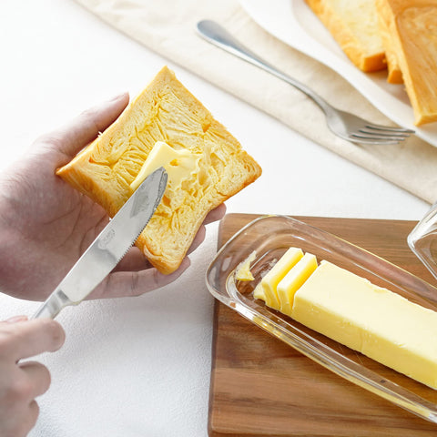 Elegant glass presentation for serving butter or small spreads.