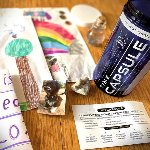 QPS time capsule with notes and photos inside for future keepsakes.