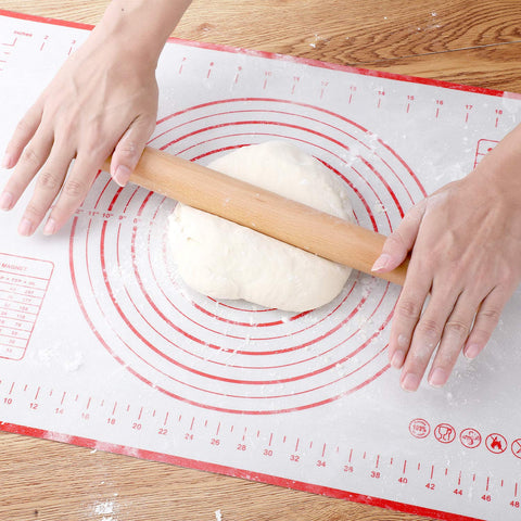 QUELLANCE measuring pastry mat supports large dough sheets for pizzas and pies.