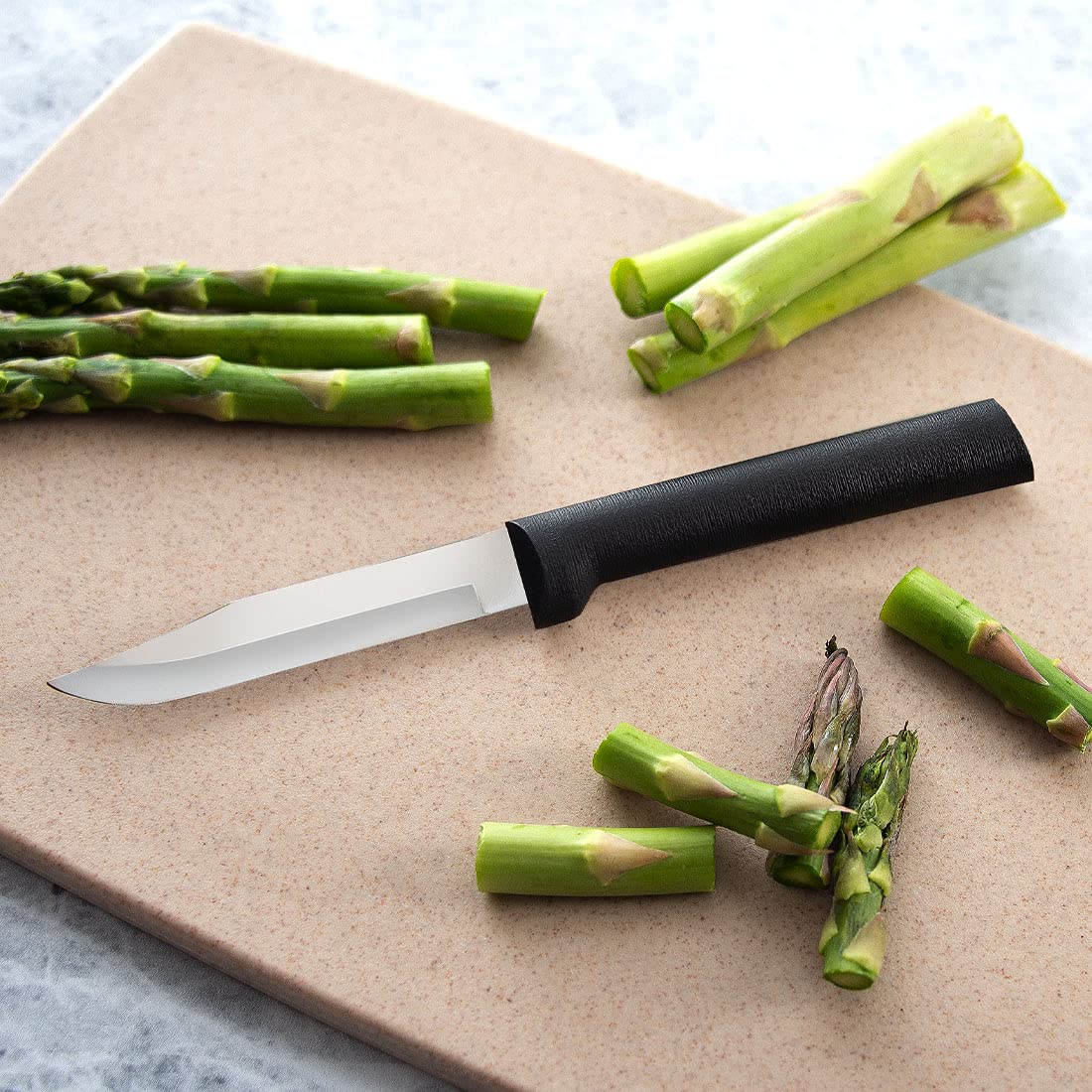 RADA Everyday Paring Knife in action peeling an apple smoothly.