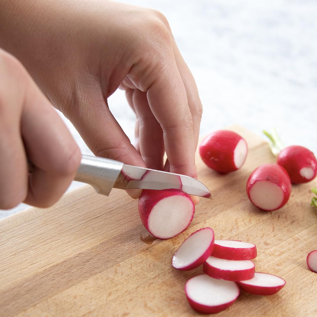RADA Granny Paring Knife close up being used to peel apples