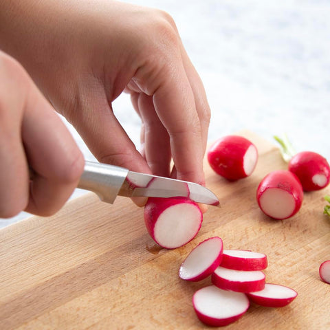 RADA Granny Paring Knife close up being used to peel apples
