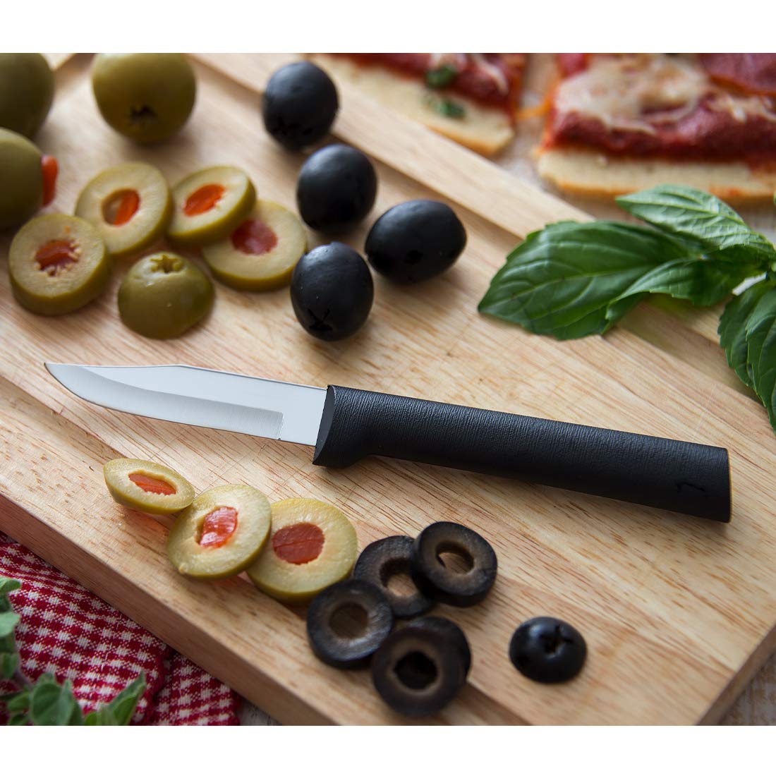 RADA peeling paring knife in use peeling an apple smoothly.