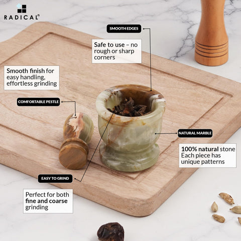 Radicaln cleaning the marble mortar pestle with a damp cloth.