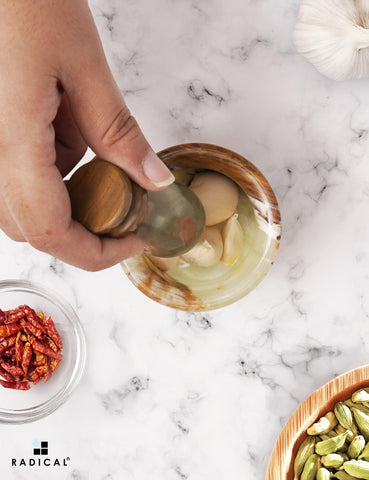 Radicaln mortar-pestle in a kitchen scene for versatile grinding prep.