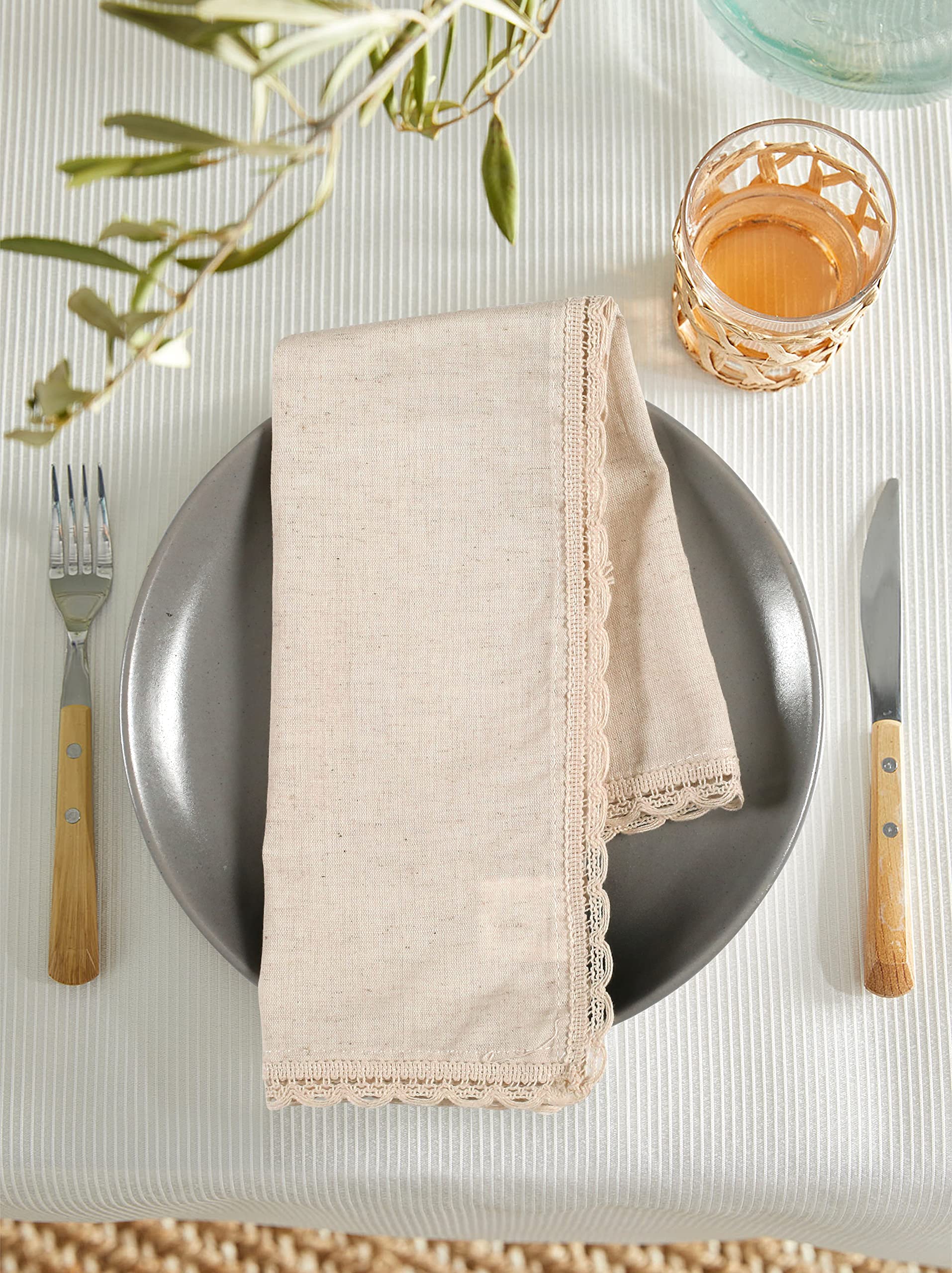 Ramanta Home napkins folded around utensils for creative place settings