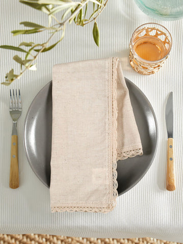 Ramanta Home napkins folded around utensils for creative place settings