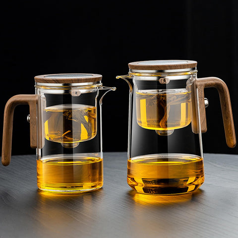 Rayfox loose-leaf tea brewing demonstration seen through clear glass.