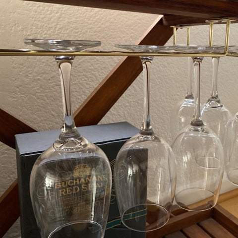 RedDreamer kitchen-bar display keeps glasses organized for quick entertaining prep.