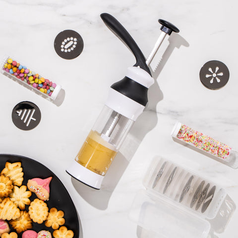 Reifier cookie press 14-piece set with storage case keeps accessories organized.