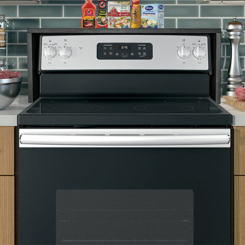 RELODECOR spice rack fits above a glass top stove to reduce clutter