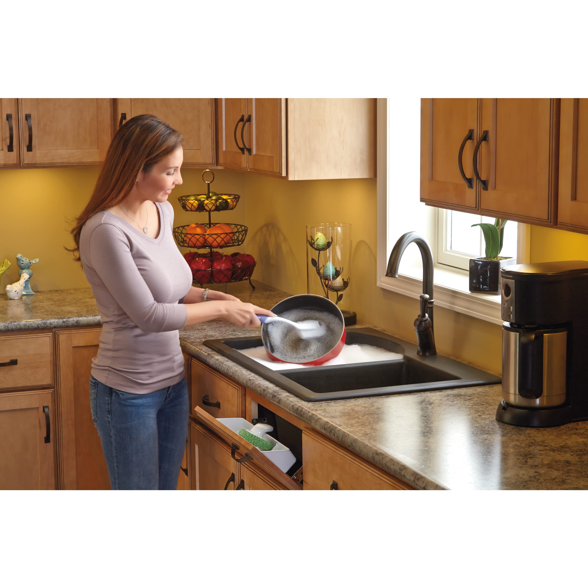 Rev-A-Shelf tip-out tray installed in a cabinet for quick access.