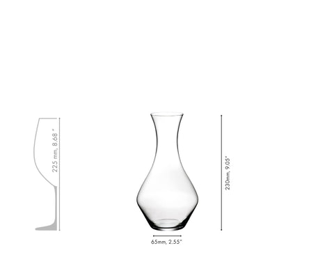 Riedel Cabernet decanter on kitchen counter with bottle cleaner for maintenance.