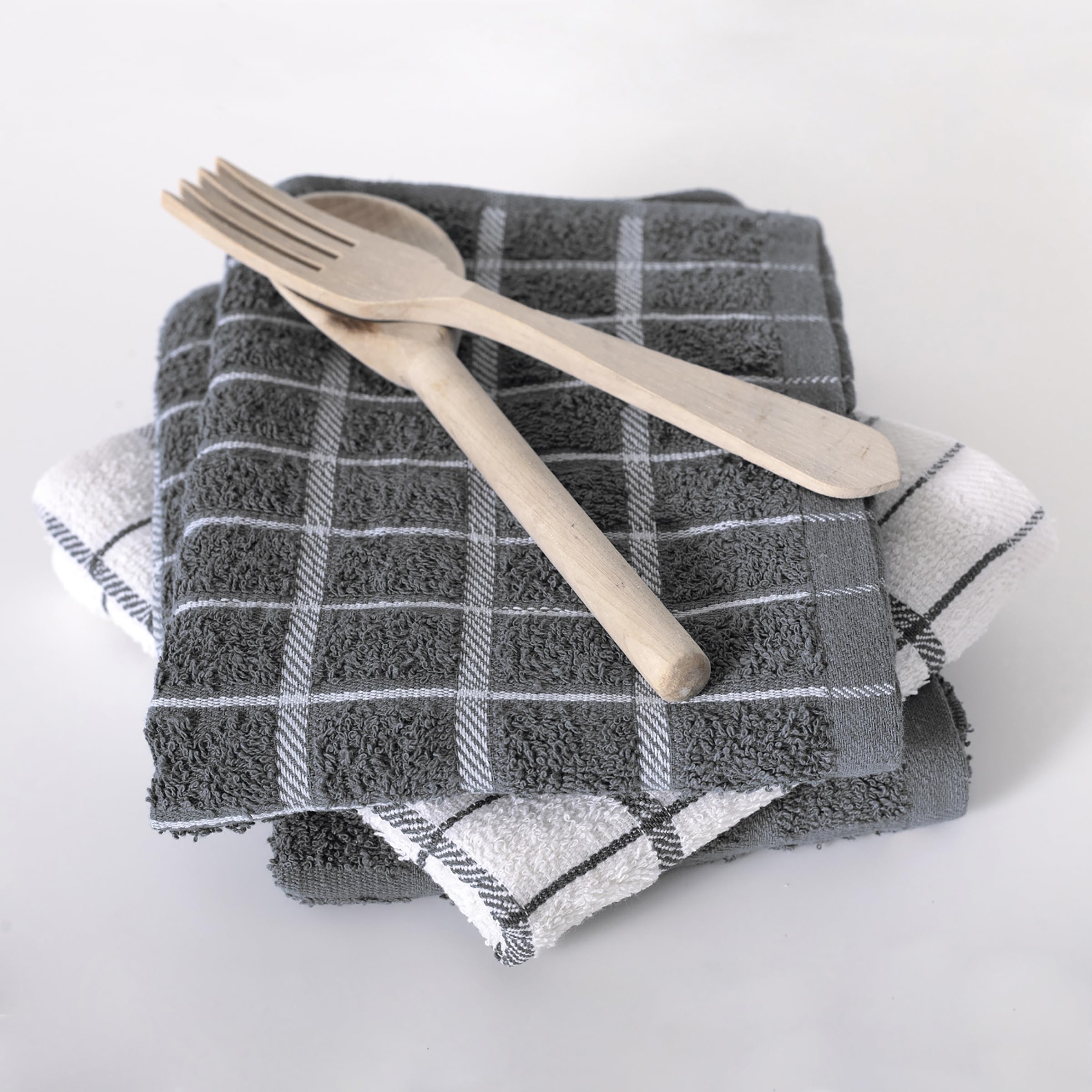 Ritz coordinating kitchen textiles shown with aprons and glassware.