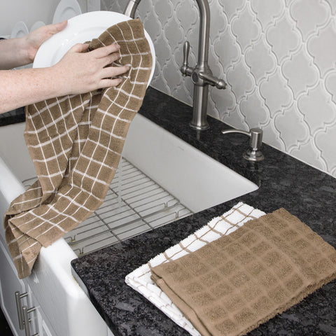 Ritz Terry kitchen towel drying dishes and wiping counters efficiently.
