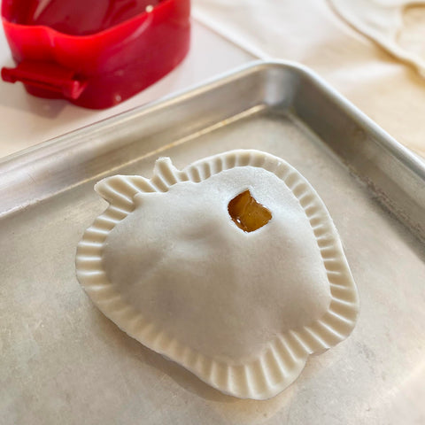 R&M Pocket Pie Maker compact storage on kitchen shelf.
