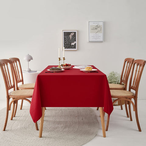 Romanstile 60x84-inch red tablecloth fits rectangular tables for festive occasions.