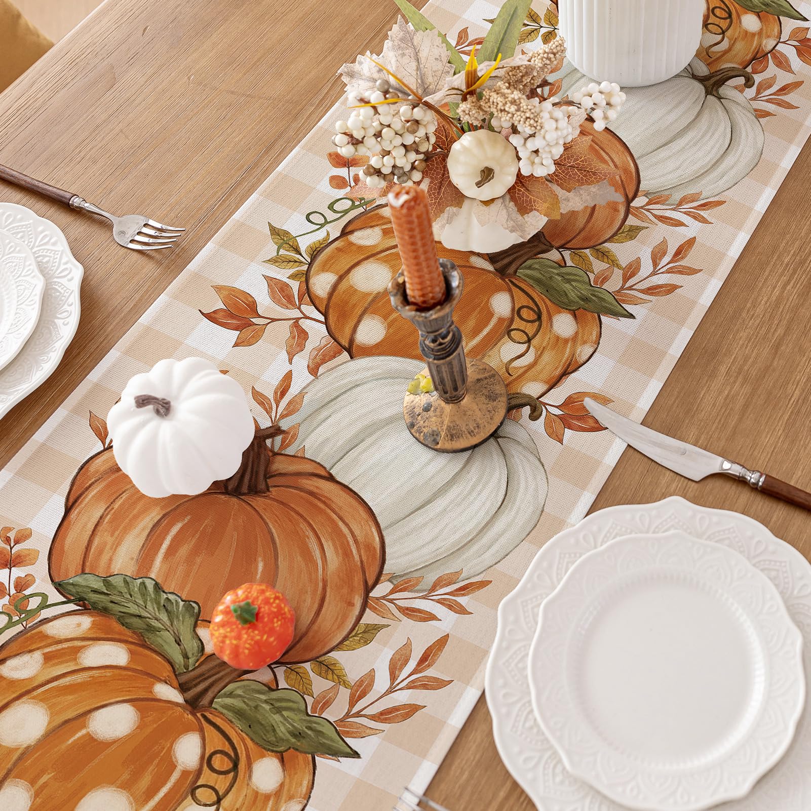 Romanstile fall harvest table runner in orange adds cozy ambiance.