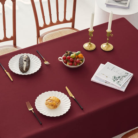 Romanstile wedding banquet setup with burgundy tablecloth for sophisticated ambiance
