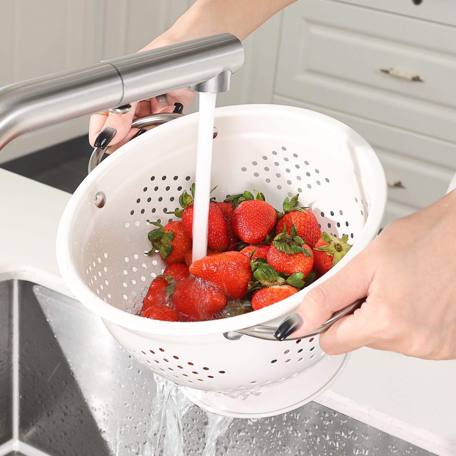 Rorence colanders in use for rinsing greens or draining pasta.
