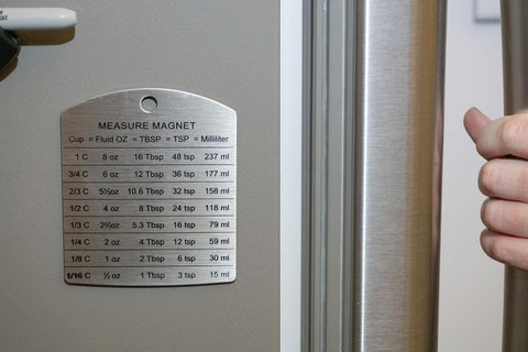 RSVP Endurance magnet on refrigerator keeping conversions handy without clutter.