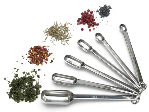 RSVP Endurance spice spoons nested on the storage chain for easy access
