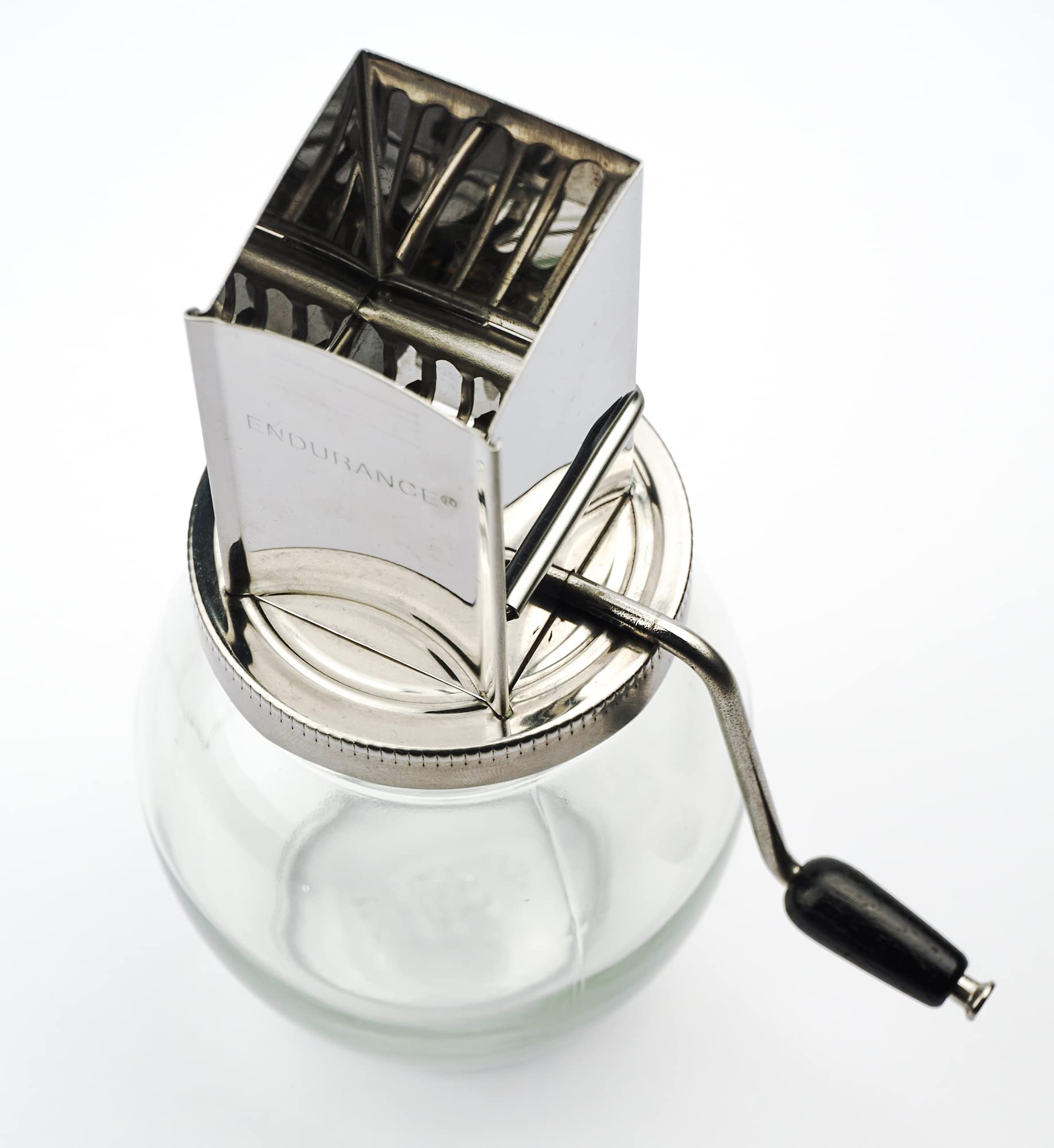 Manual crank handle on Endurance nut grinder for controlled grinding