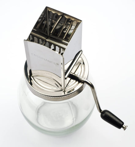 Manual crank handle on Endurance nut grinder for controlled grinding