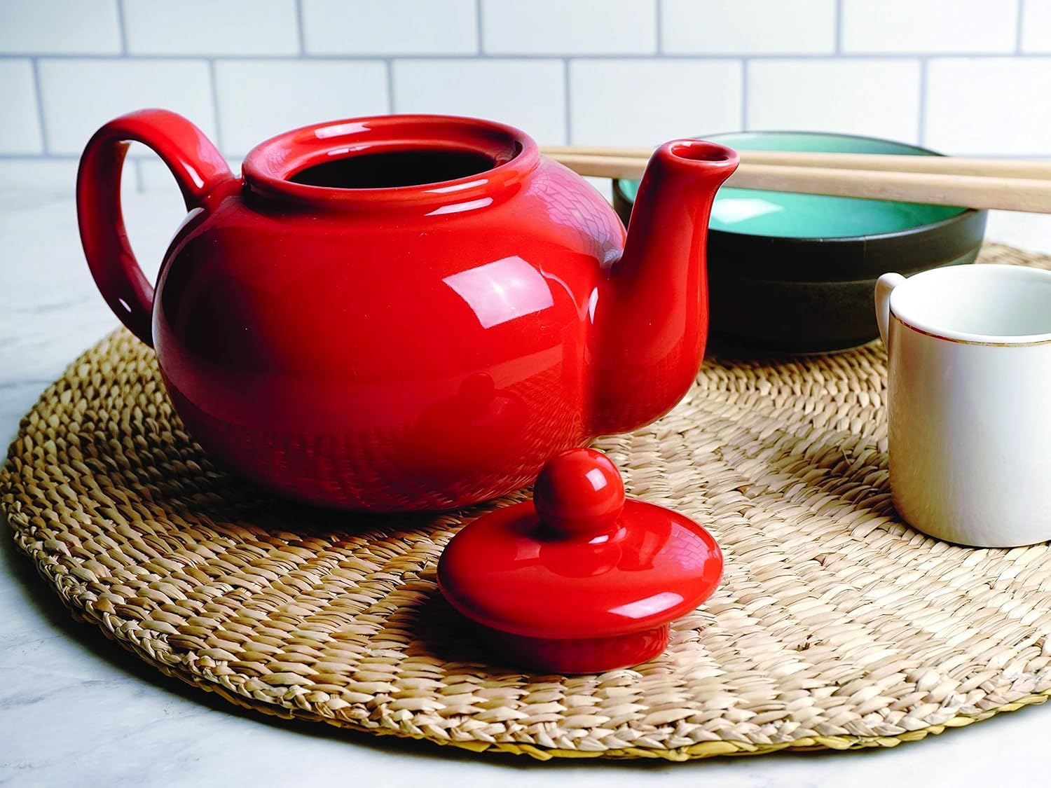 RSVP International red teapot demonstrates dishwasher-safe care for easy cleanup.
