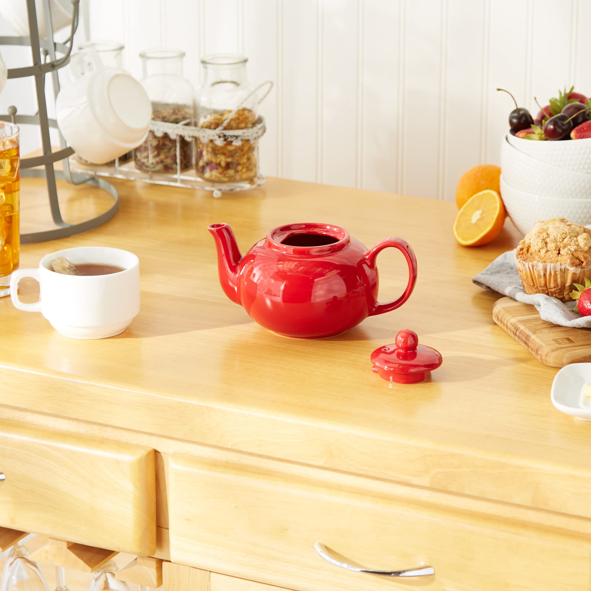 RSVP International red teapot shown in a kitchen setting for everyday tea rituals.