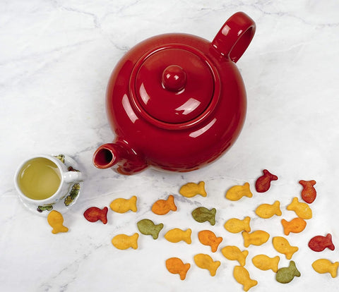 RSVP International red teapot features seamless one-piece stoneware construction.