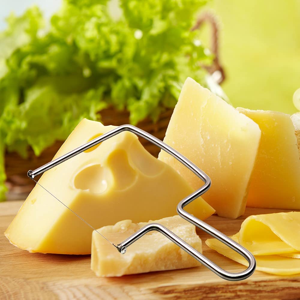 Aeon Design cheese slicer in action slicing hard cheese.