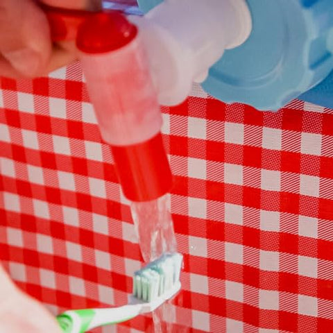 Sagan Life AquaBrick dispensing setup at beach or park for gatherings.