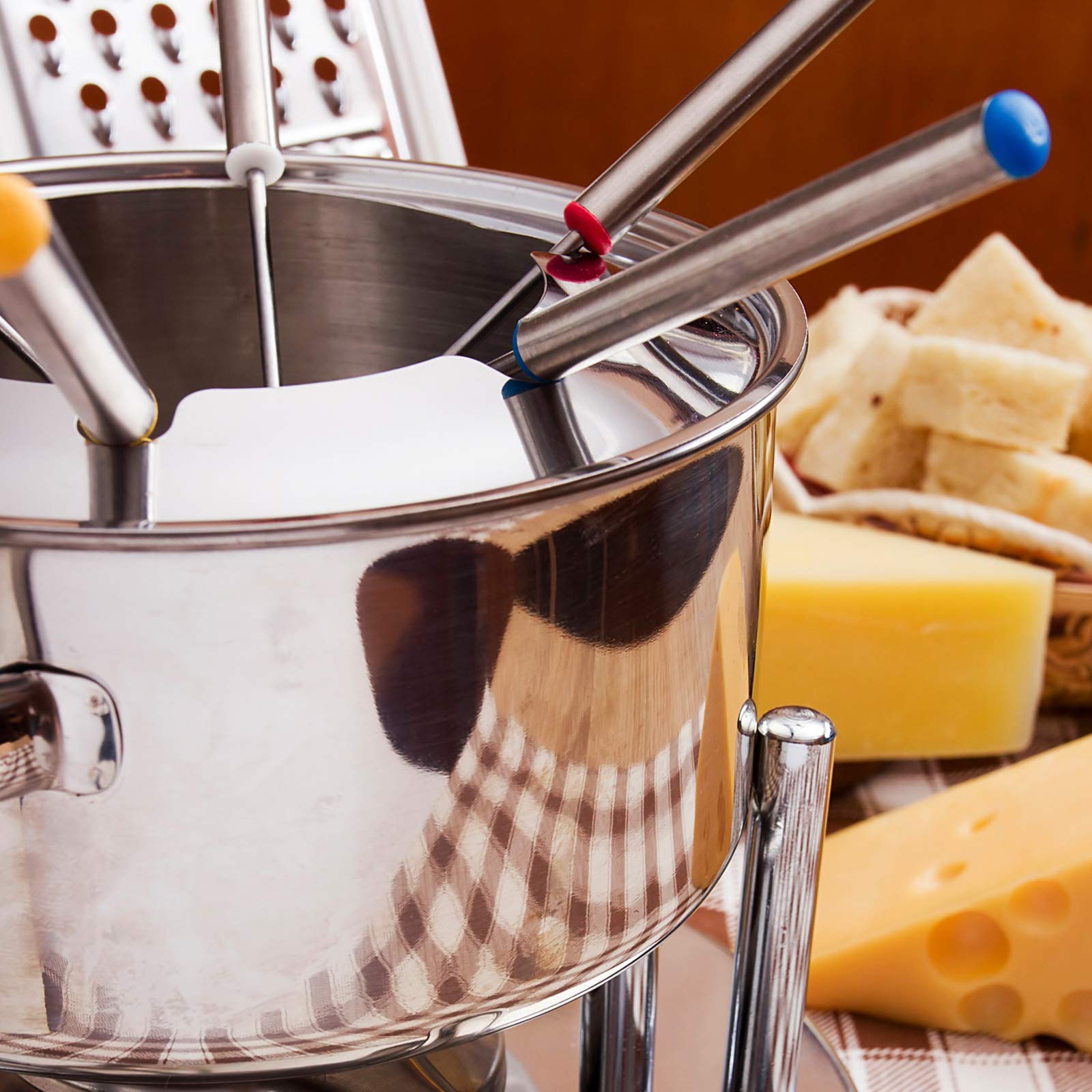 Sago Brothers fondue forks in use with cheese fondue and fruit.