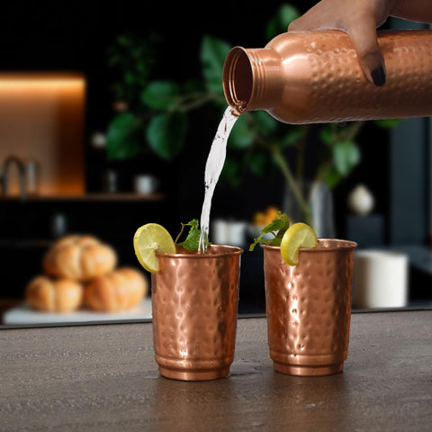 SAJTOX 350ml copper tumbler in hand, ideal for water and herbal drinks.