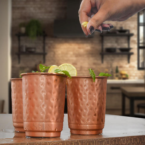 Reusable SAJTOX copper tumbler demonstrates eco-friendly choice for daily use.