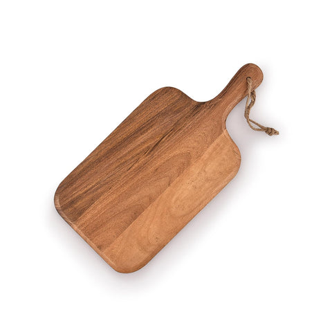 Samhita acacia board featuring vegetables in prep on a sturdy surface.