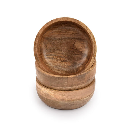 Samhita mango wood round bowl with nuts for easy sharing.