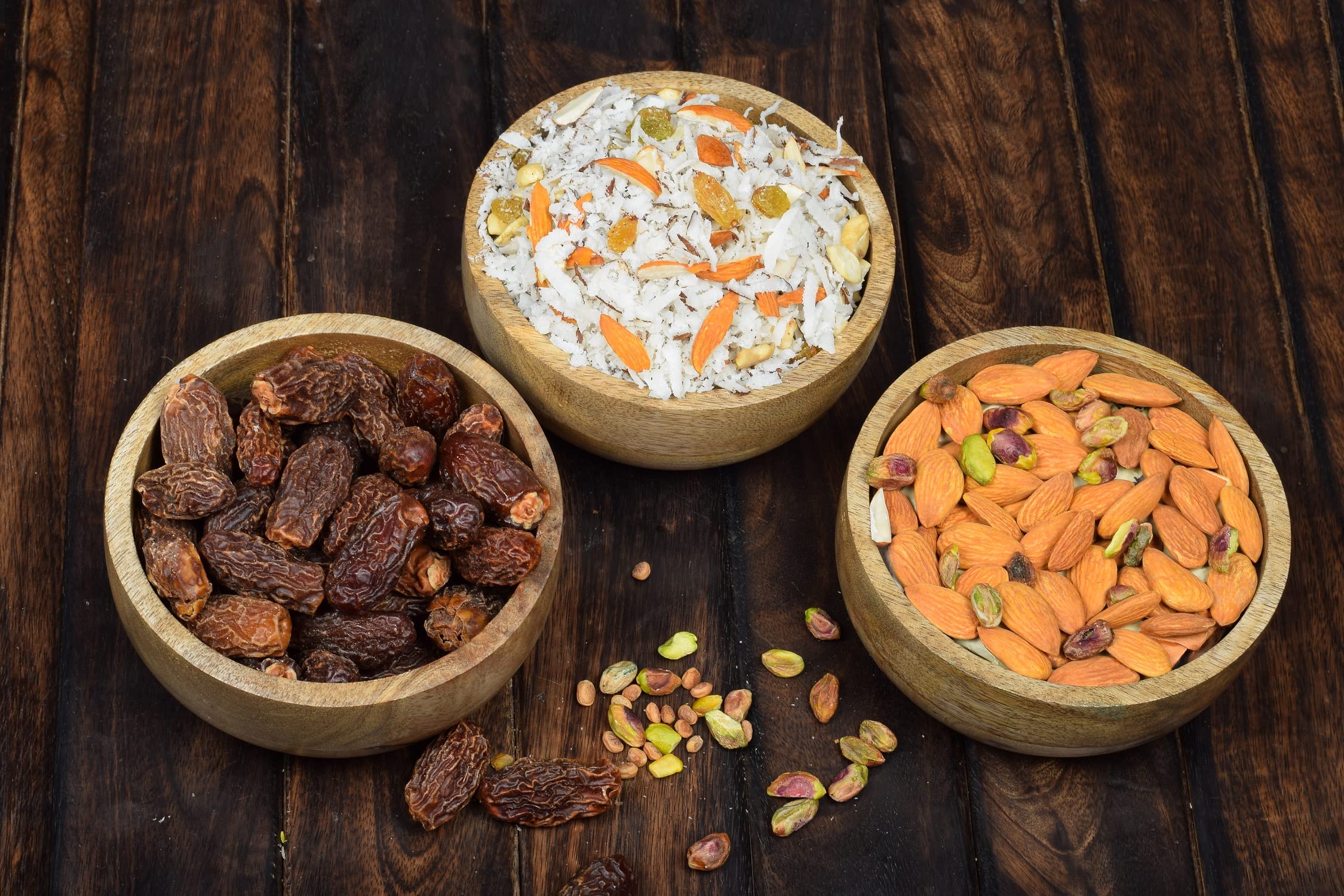 Samhita mango wood round bowl with olives and dip for appetizers.