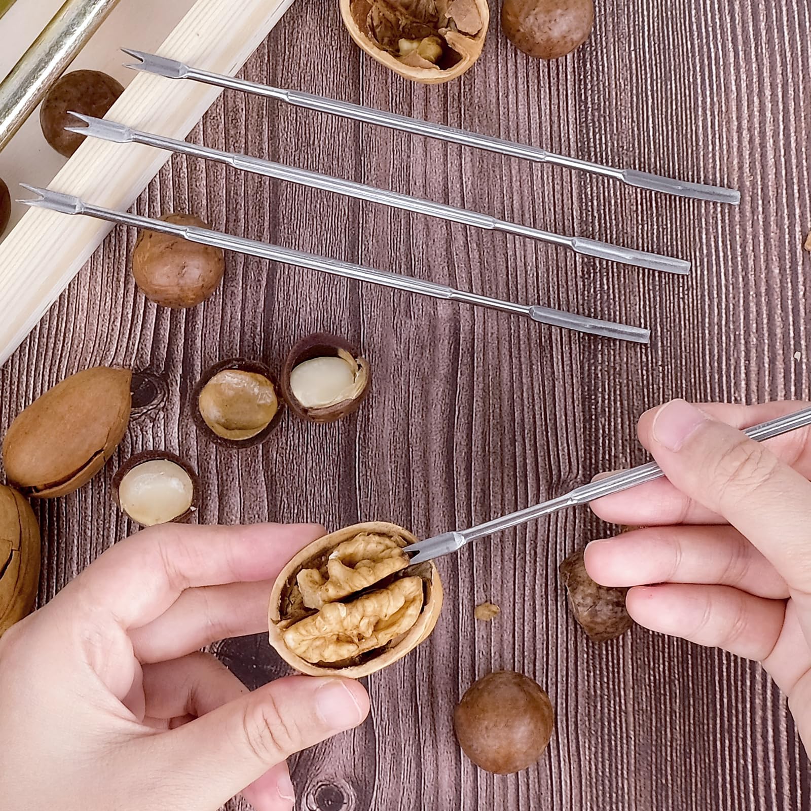 Includes four stainless steel picks to extract kernels.