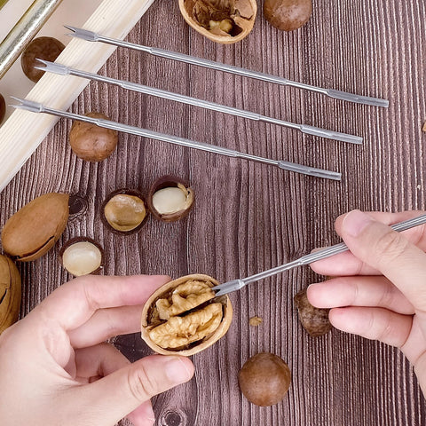 Includes four stainless steel picks to extract kernels.