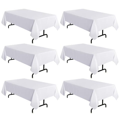 Sancua six-pack white tablecloths 60x120 on a dining table, clean and polished.