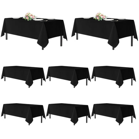 Sancua black 54x108 tablecloth on a rectangular table for an elegant setup