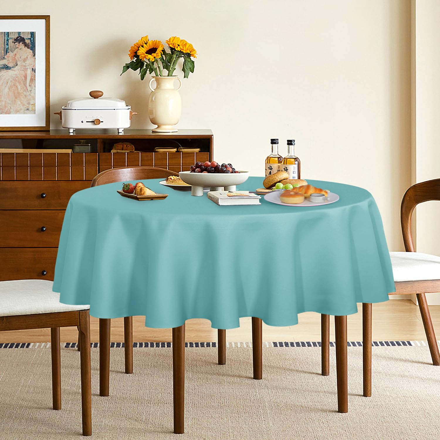 Sancua turquoise dining setup with round tablecloth for elegant presentation.