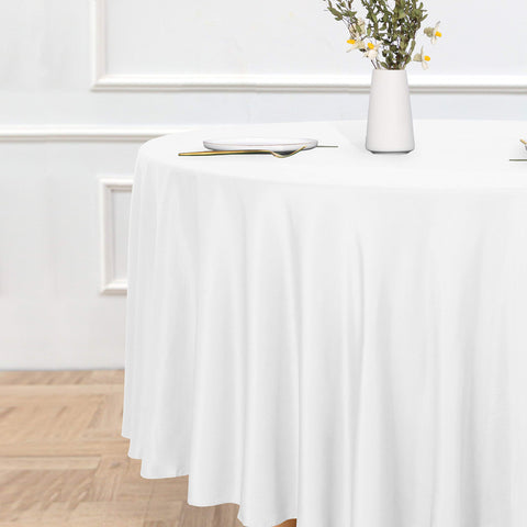 Sancua 108-inch white water-resistant tablecloth ready for outdoor meals.